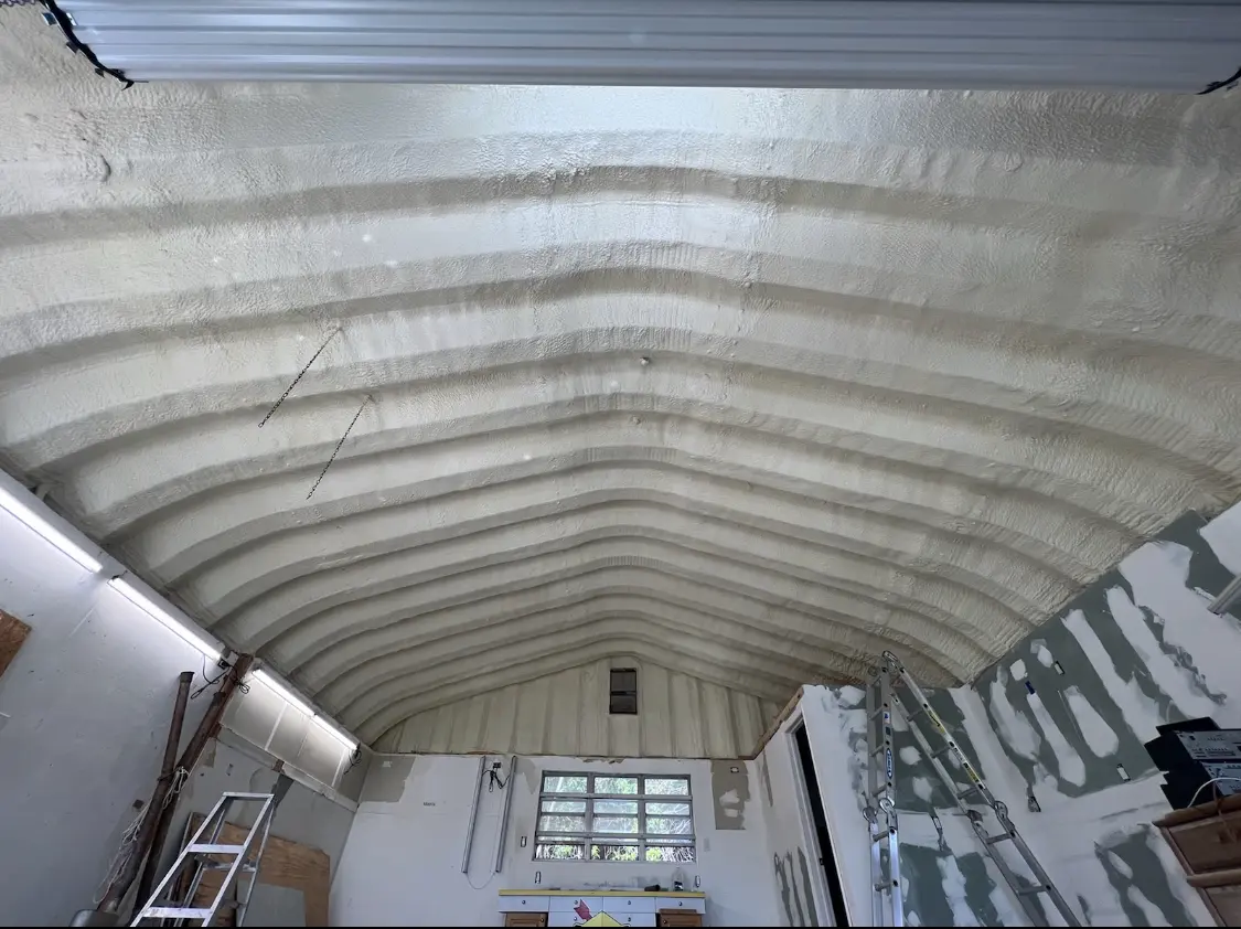 Spray polyurethane foam applied to the underside of a metal roof deck in Picnic Point